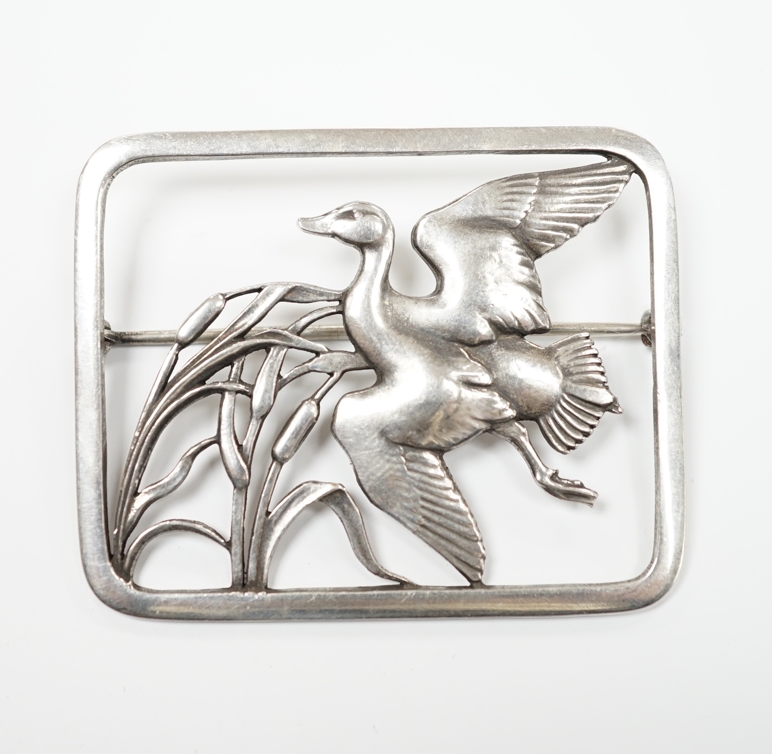 A Georg Jensen sterling 'duck in flight amid bulrushes' rectangular brooch, design no. 300, 47mm.